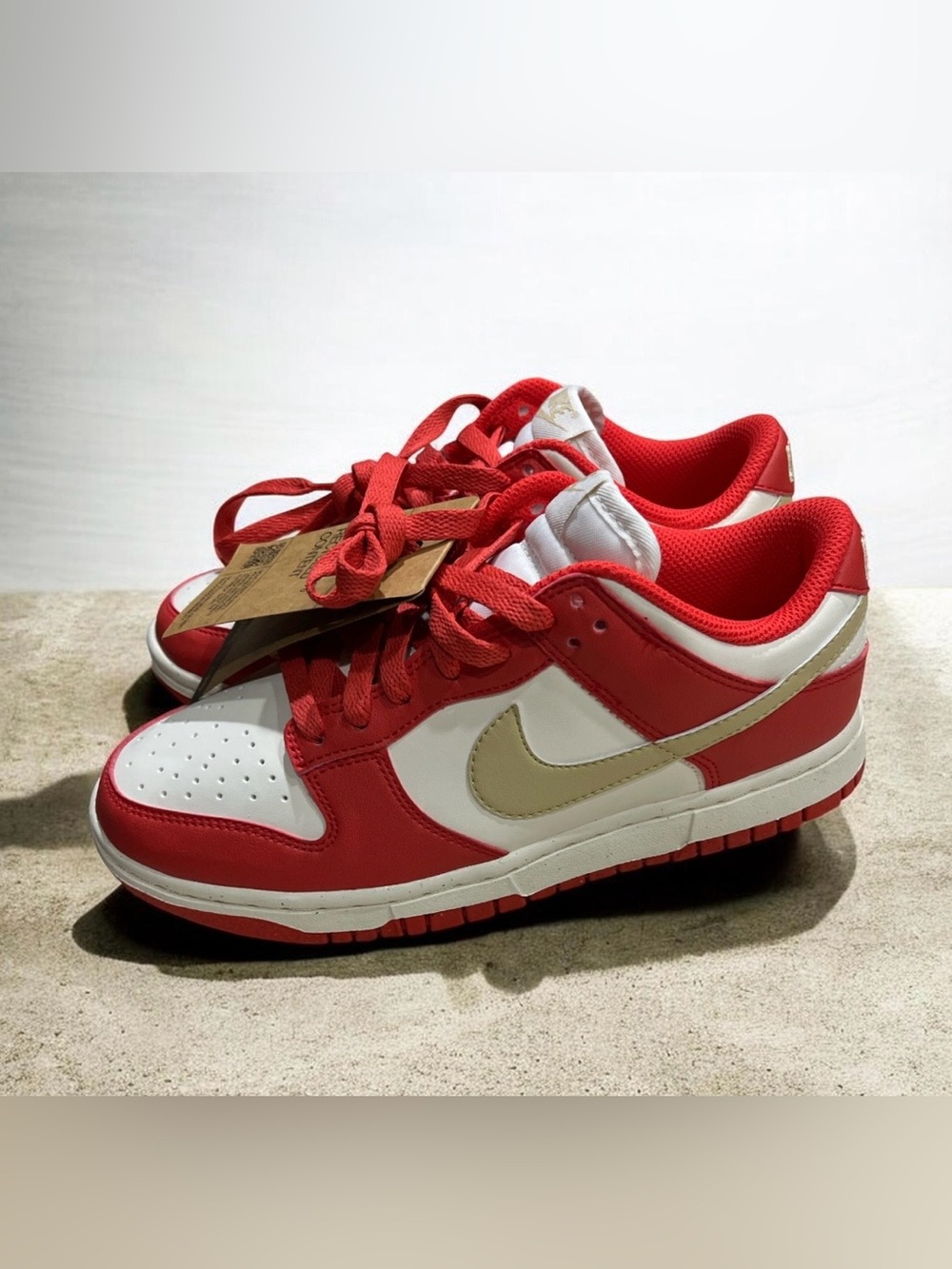 Nike Women’s Dunk Low Next Nature 'Light Crimson Team Gold' sneakers. 7